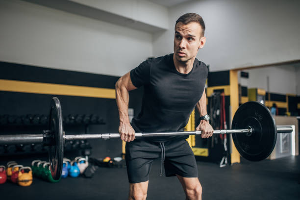 istock Strong man weightlifting in gym 1470079160