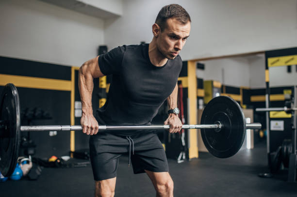 istock Strong man weightlifting in gym 1470079179