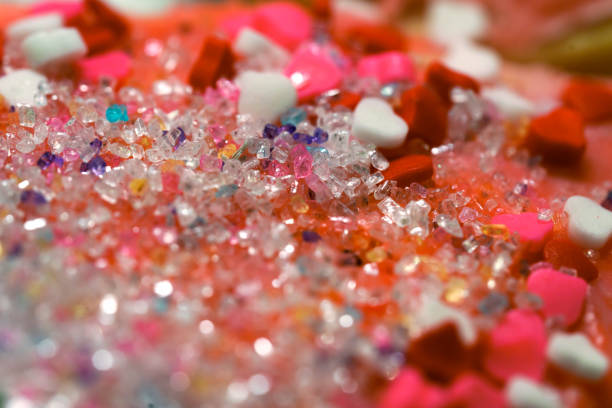 Valentine's Day Sugar Cookies Closeup - Macro details of sugar crystals on colorful red, white and pink glazed cookie sweets.