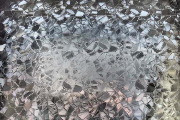 istock Fluted glass with backlight. Beautiful multicolored refraction of light. Abstract background. Self-adhesive film. Ribbed glass surface. Embossed glass background 1470081000