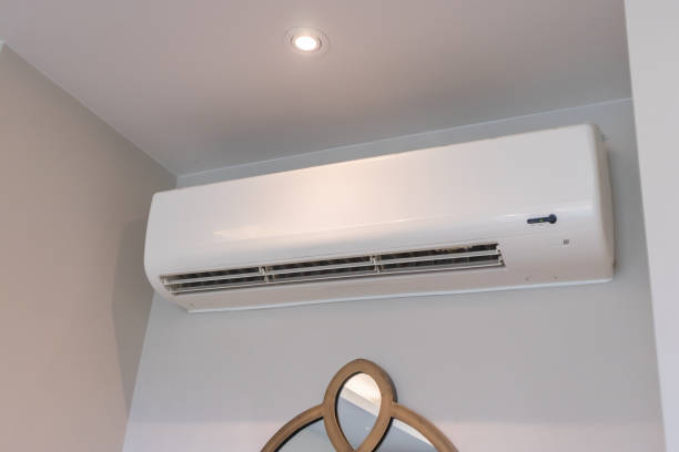 istock Air conditioner on white wall room interior background 1470081509