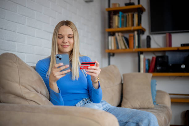 istock Happy young customer enjoys shopping online 1470083537