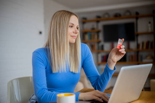 istock Happy young customer enjoys shopping online 1470083634