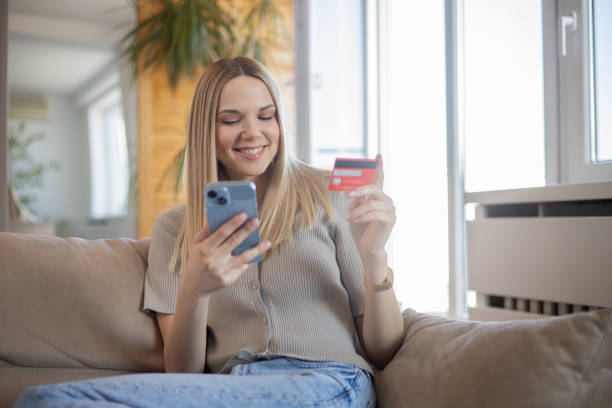 istock Happy young customer enjoys shopping online 1470083709