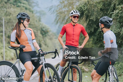 istock Asian Chinese Cyclist resting at roadside waiting for team mates 1470084900