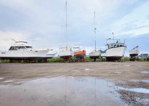 Diverse type of dry dock boats in a marina