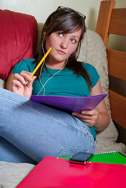 Teen listens to music stock photo