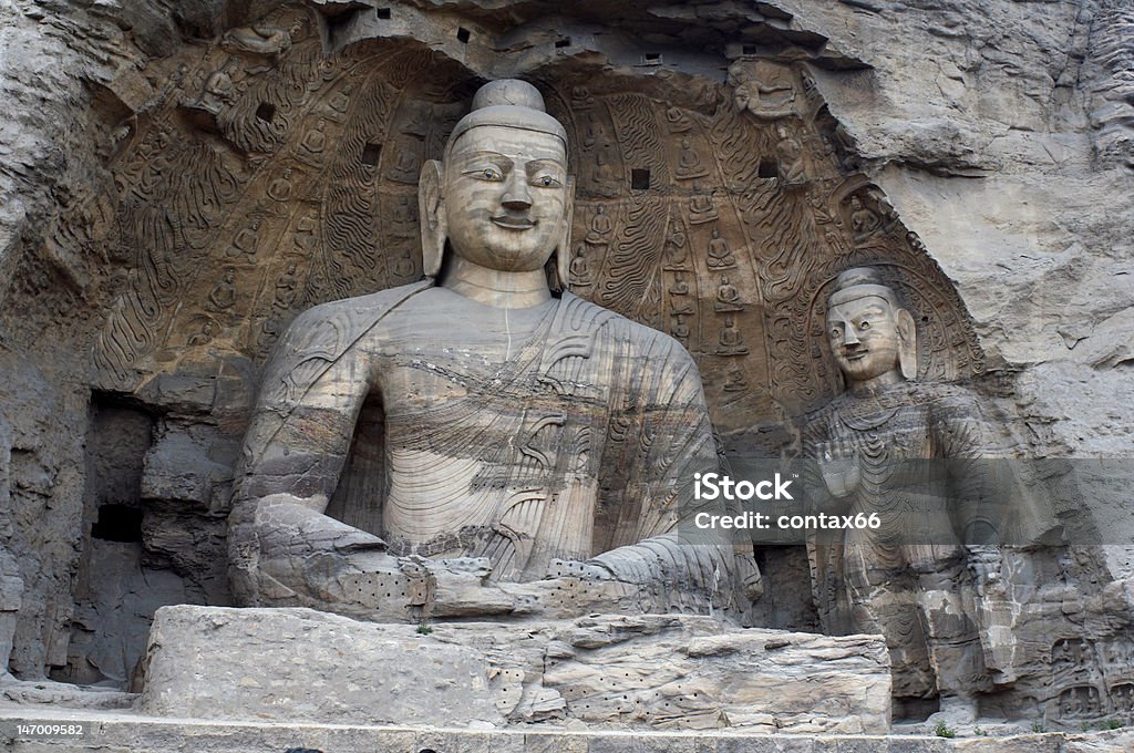 Escultura de pedra de Buda em as Grutas de Yungang - Foto de stock de Arqueologia royalty-free