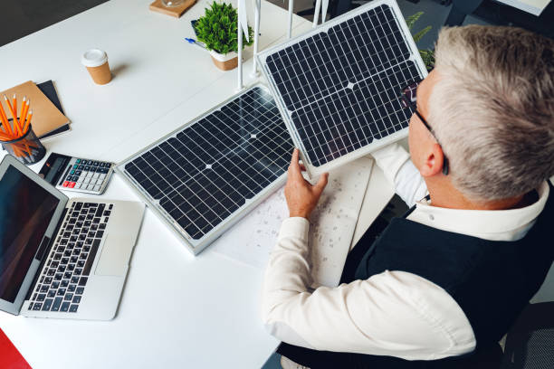 istock Male mature architect working on an ecological construction project in office 1470096045