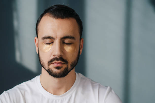 istock Relaxed handsome man sitting with his eyes closed and meditating while being home alone. Repose and relaxation free time, no anxiety and stress daydreaming concept 1470097237