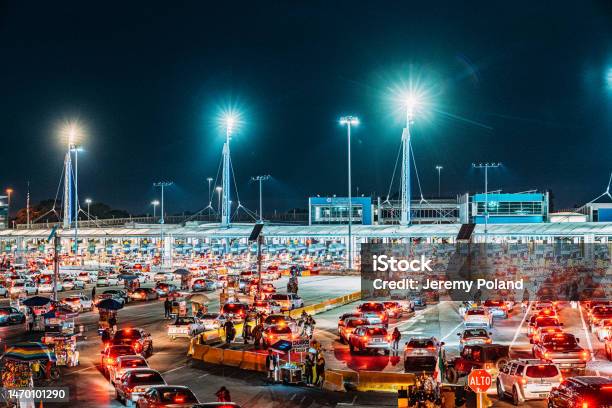 Busy Long Lines Of Vehicles Waiting To Cross The Usmexico Border At Tijuanasan Ysidro Into San Diego California Us Stock Photo - Download Image Now