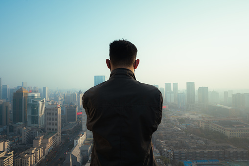 Like a man looking at the city from afar