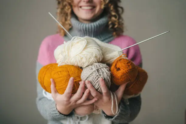 Art creative woman hands with yarn balls for knitting. Selective focus. Creative concept. People lifestyle concept.