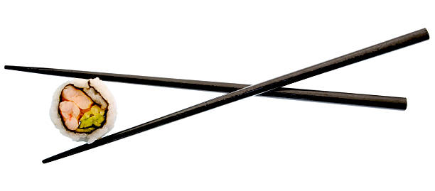 istock sushi and black chopsticks isolated on white 147010302