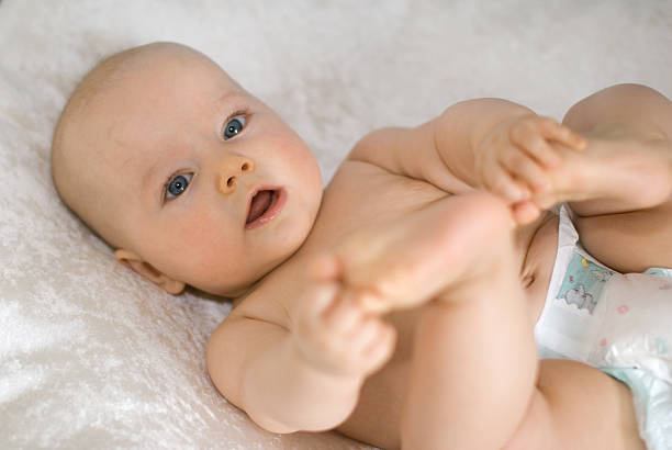 istock Baby playing with  his feet 147010613