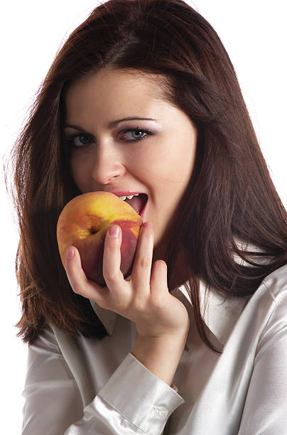 istock The girl with a peach 147010878