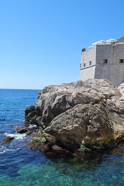 istock Castle and rocks in Mediterranean Sea, Craotia 147010965
