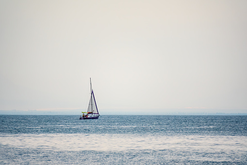 Sailboat during sailing. High angle view photo from drone DJI Mavic 2 Pro (Hasselblad camera).