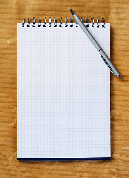 Note pad with pen. stock photo