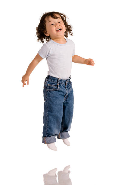istock Toddler jumping on white background 147011881
