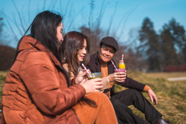 istock Cheerful Asian Family Enjoying An Outdoors Walk 1470120765