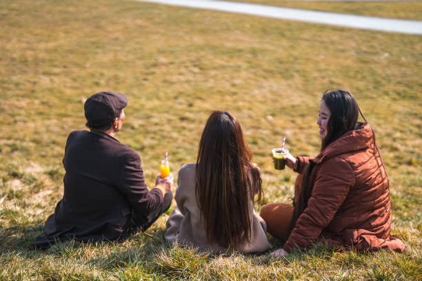 istock Cheerful Asian Family Enjoying An Outdoors Walk 1470120768