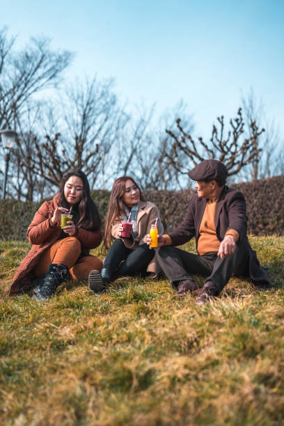 istock Cheerful Asian Family Enjoying An Outdoors Walk 1470120772
