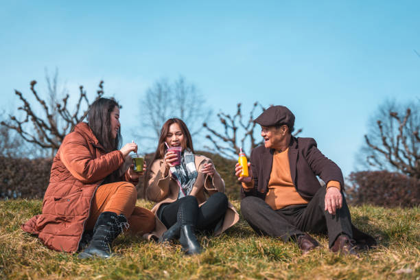 istock Cheerful Asian Family Enjoying An Outdoors Walk 1470120806