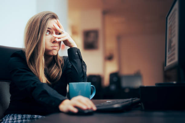 Woman Covering Her Eyes while Browsing the Internet Content moderator feeling terrified of what she sees embarrassment stock pictures, royalty-free photos & images