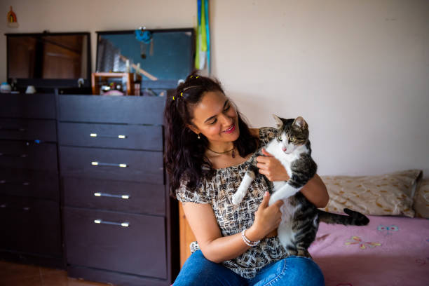 istock Woman having time with her cat in home 1470123598