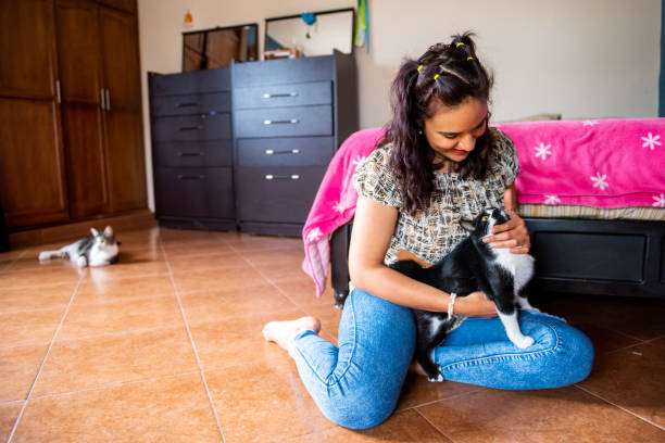 istock Woman having time with her cat in home 1470123725