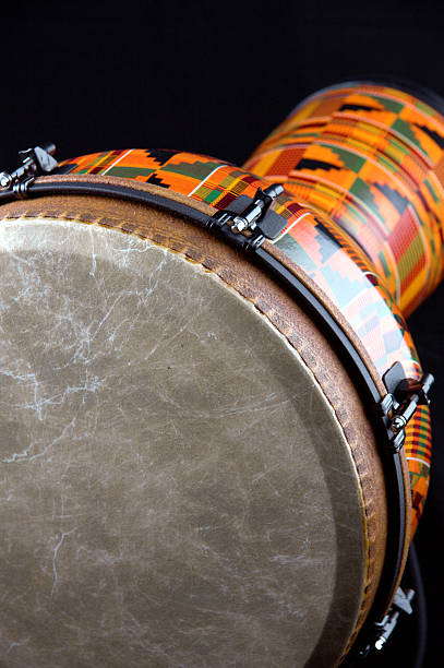 istock Orange or Brown Djembe Drum Black Background 147012376