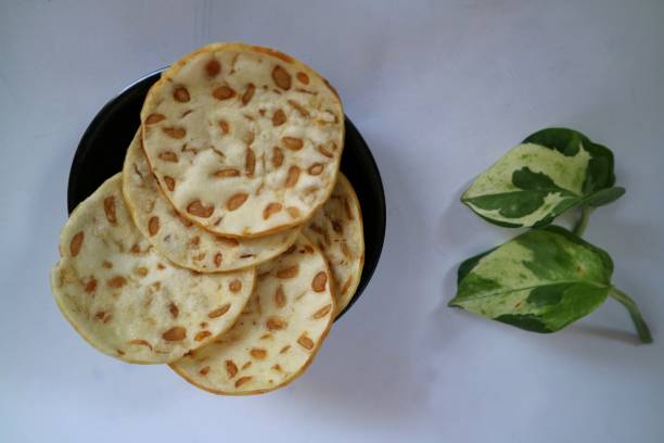 istock Keripik Tempe or Tempe chips on black tiny plate. a typical Indonesian food made from thinly sliced ​​tempeh and then fried using seasoned flour. 1470124298
