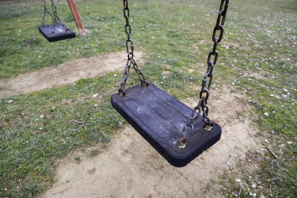 istock Swings in a playground 1470125415