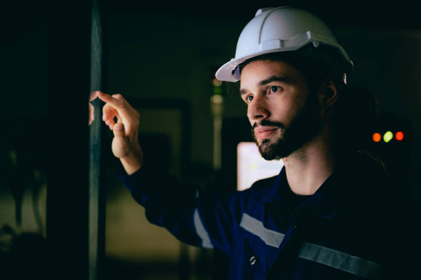 istock Professional technician checking and repairing part of automatic machine 1470125722