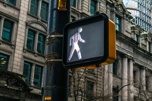 Pedestrian walk signal located in downtown Vancouver, British Columbia.
