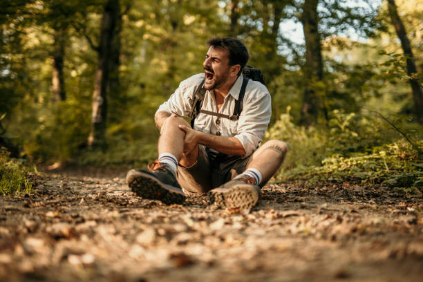 istock Hiker fall and having a knee injury 1470128523