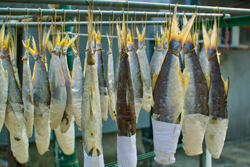 Salted fish in Chinese style. Being processed outdoor in Hong Kong.