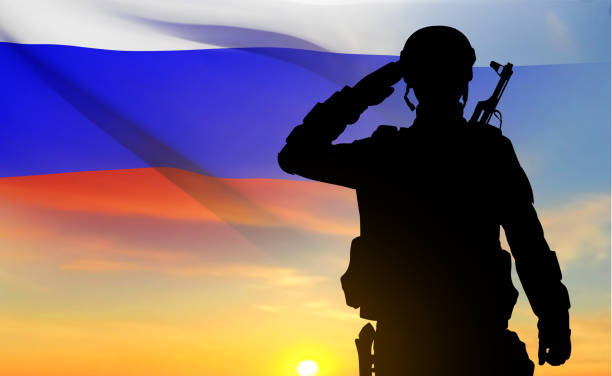 istock Silhouette of Russian soldier on background of sunset 1470129626