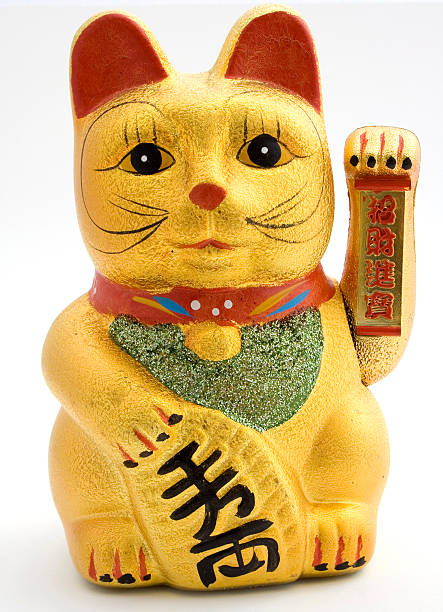 istock Gold ceramic statue of cat holding left arm up 147013229