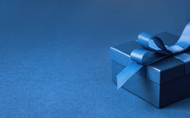 istock Part of gift box with a blue bow on blue 1470134908