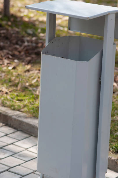 istock Grey garbage can on the street 1470136552