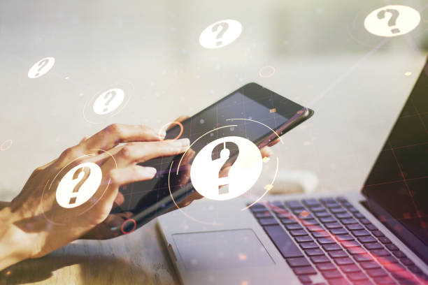 istock Creative concept of question mark illustration and finger clicks on a digital tablet on background. FAQ and search concept. Multiexposure 1470141294