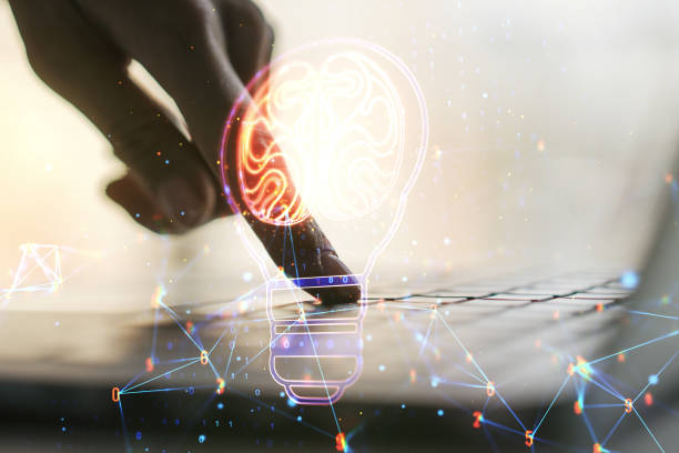 istock Double exposure of creative light bulb hologram with human brain and with hands typing on laptop on background, idea and brainstorming concept 1470141341