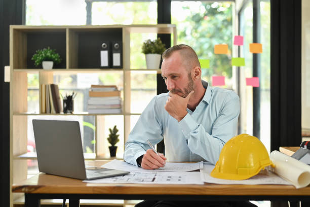 istock Focused engineer man watching online webinar training or having virtual meeting video conference on laptop. 1470144248
