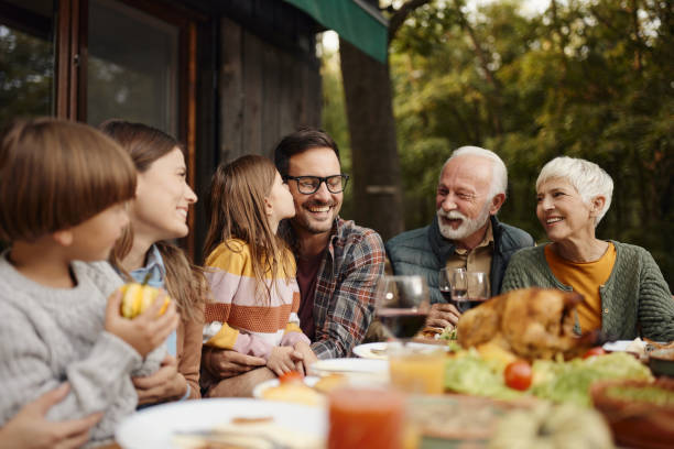 istock Happy extended family enjoying during lunch on a terrace. 1470146249