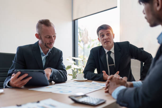istock Group of Business financial with finance reports to analyze big data, balance sheet, strategy at meeting room. 1470146830