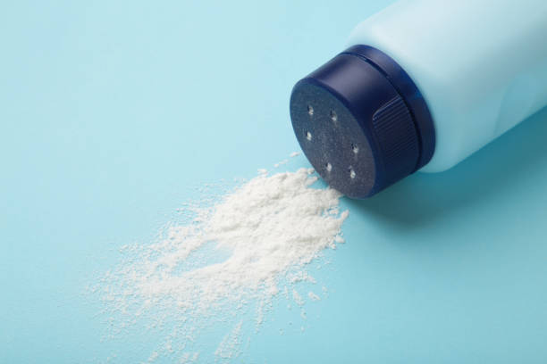 istock Baby powder on blue background. Baby cosmetics. Space for text 1470147890