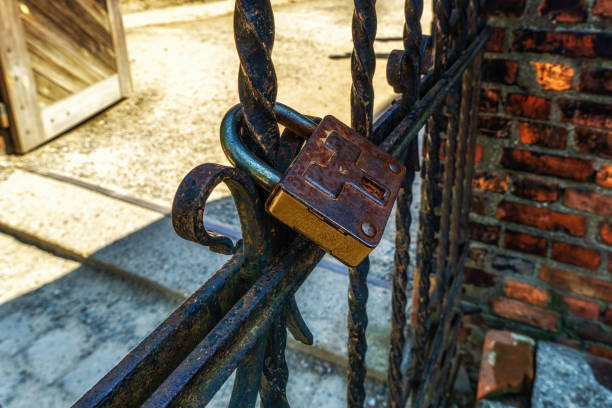 Oswiecim, Poland- 15 August 2022: The lock on the gate to the Auschwitz concentration camp (Krakow, Poland)