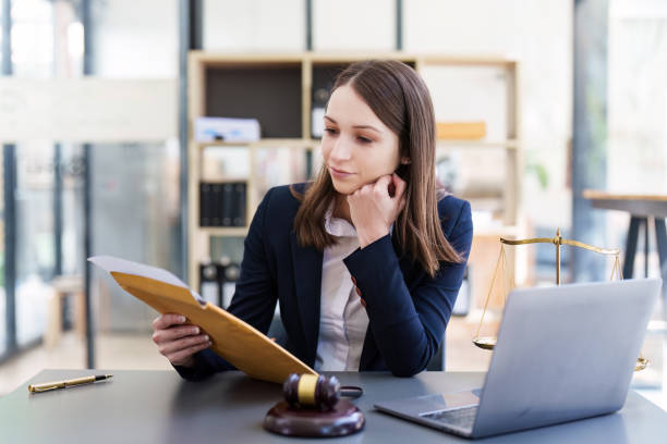 istock Business Lawyer consulting online on laptop while working at office. 1470149708